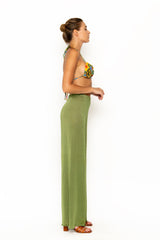Sommer Swim model facing sideways and wearing Calvi Lounge pant in Campari
