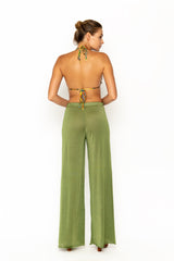 Sommer Swim model facing backwards and wearing Calvi Lounge pant in Campari