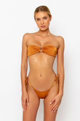 Sommer Swim model facing forwards and wearing a Cece Bandeau bikini top in Papagayo