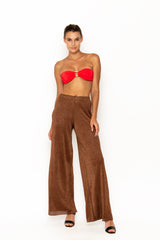 Sommer Swim model facing forward and wearing Calvi Lounge pant in Campari