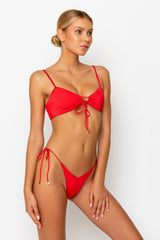 Sommer Swim model facing sideways to the left and wearing a Cara brazilian bikini bottom in Venrere