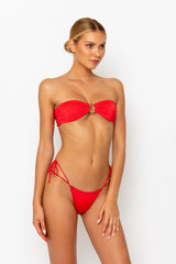 Sommer Swim model facing sideways to the left and wearing a Cece bandeau bikini top in Venere